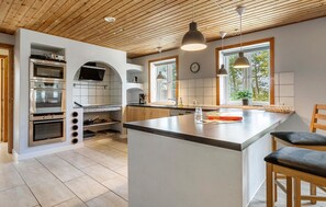 Fridge, stovetop, dishwasher, coffee/tea maker