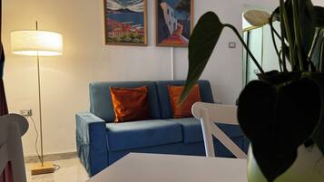 Superior Condo | Living area | 42-inch Smart TV with digital channels, first-run movies