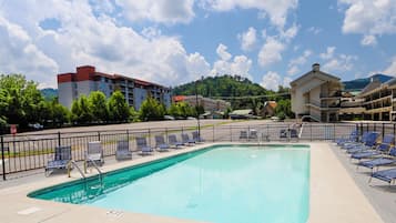 Seasonal outdoor pool, open 7:00 AM to 10:30 PM, pool umbrellas