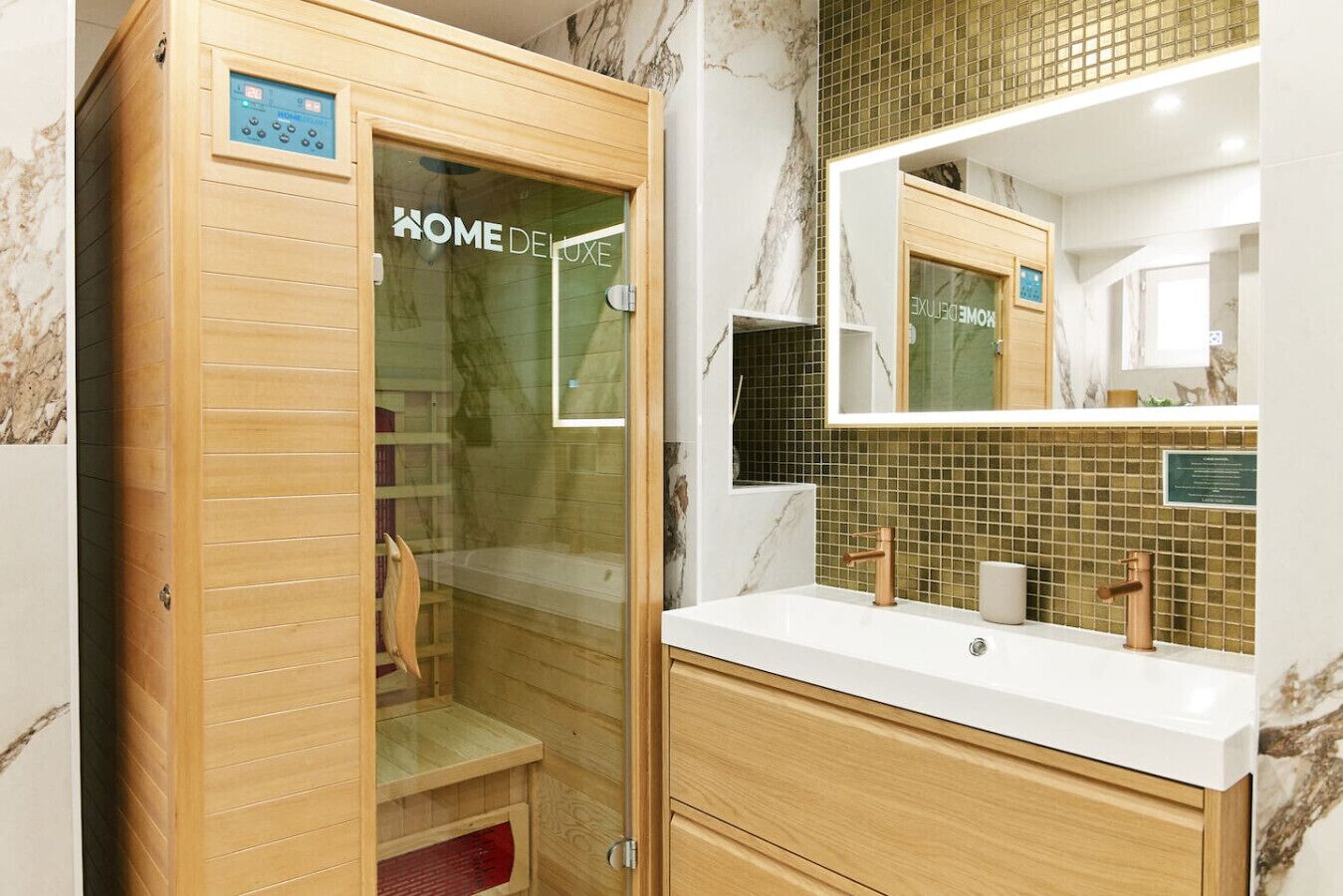 A modern bathroom with a wooden cabinet, a glass shower enclosure, and a marble-tiled wall.