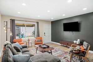 Smart TV, fireplace, foosball, books