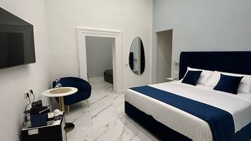 Superior Quadruple Room, Balcony, Courtyard View | Minibar, in-room safe, desk, blackout curtains