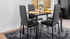 A modern kitchen with a dining table, chairs, and a refrigerator. - Cozy & Modern 3BR Houston Townhome - WiFi + AC (Houston)