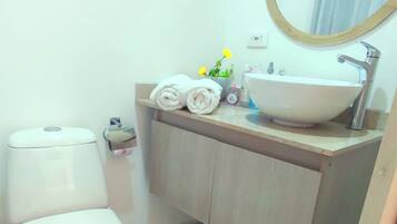 Shower, hair dryer, towels, soap