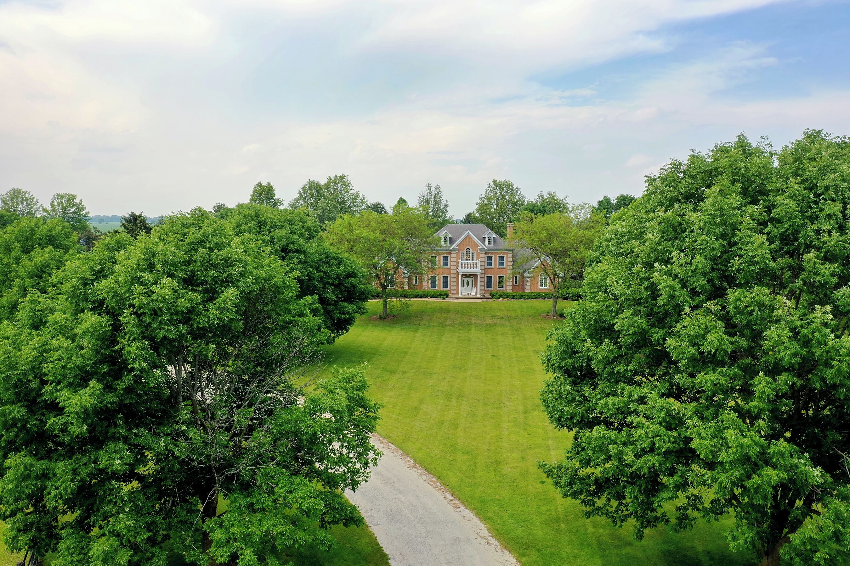 Meticulously manicured property with lots of mature trees to provide shade. Spacious front yard for games or relaxing.