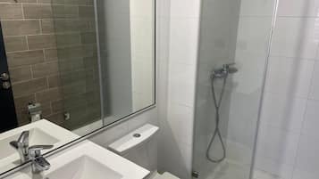 Shower, towels, soap, toilet paper