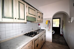 Fridge, dishwasher, coffee/tea maker, cookware/dishes/utensils