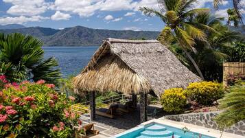 Private pool and shaded palapa surrounded by tropical gardens