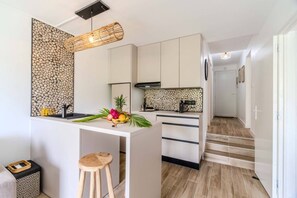 Coffee/tea maker, high chair, cookware/dishes/utensils