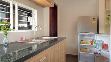 Fridge, microwave, stovetop, coffee/tea maker