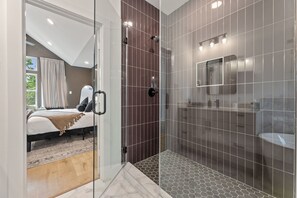 Shower, hair dryer, towels, shampoo