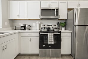 Stovetop, coffee/tea maker, toaster, cookware/dishes/utensils