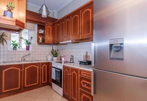 Fridge, coffee/tea maker, cookware/dishes/utensils