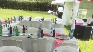 A table set outdoors with plates, cutlery, and bottled water. - Dan's Hotel Kisii (Kisii)