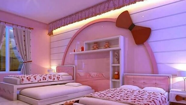 A bedroom with two beds, a built-in wardrobe, and a large window with curtains. - Dan's Hotel Kisii (Kisii)