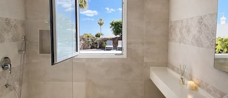 Shower, hair dryer, towels, soap
