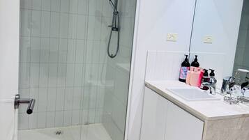 Shower, hair dryer, towels, soap