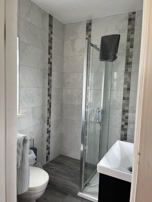 Shower, hair dryer, towels, soap