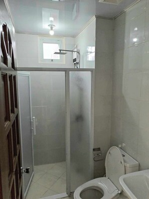 Shower, towels, soap, toilet paper