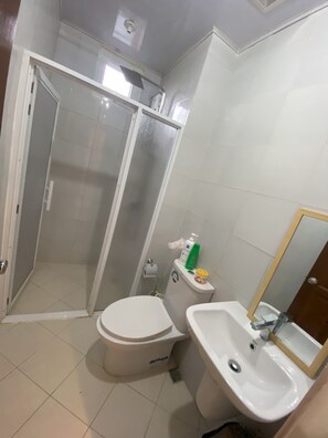 Shower, towels, soap, toilet paper