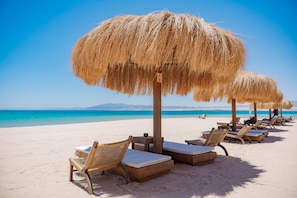 Private beach, free beach shuttle, sun loungers, beach umbrellas