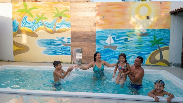 A swimming pool with a mural of a beach scene.