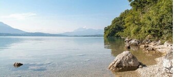 House with enclosed garden between lakes and mountains