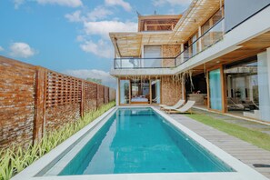 A modern house with a swimming pool, a wooden deck, and a glass conservatory. - D'Kamboja KIS1 Managed by D'Kamboja Group (Bali)