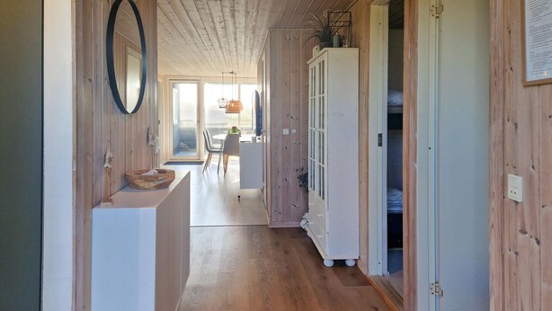 A wooden interior hallway with a white cabinet, a white refrigerator, and a wooden bench. - Gorgeous home in Løkken with sauna (Løkken)