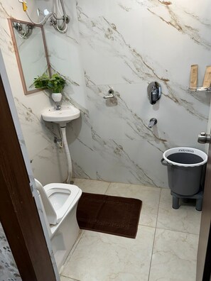 Double Room, City View | Bathroom | Shower, free toiletries, hair dryer, slippers - HOTEL APEX INN SHAMSHABAD (Hyderabad)