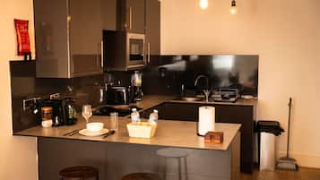 Microwave, stovetop, coffee/tea maker, cookware/dishes/utensils
