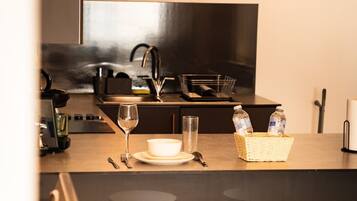 Microwave, stovetop, coffee/tea maker, cookware/dishes/utensils