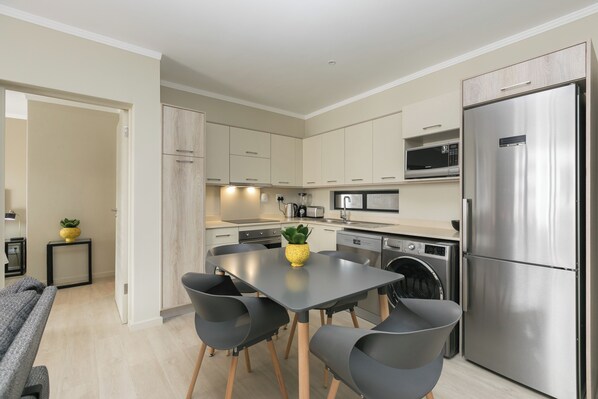 Superior Apartment, Courtyard View | Private kitchen | Fridge, microwave, oven, stovetop