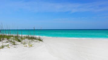 Enjoy a serene beach experience with expansive sandy shores and calm waters.