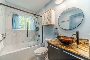 Shower, hair dryer, towels, shampoo