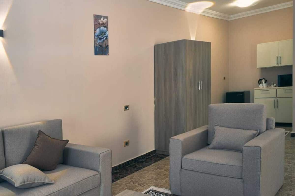 Deluxe Room, Balcony | Living area
