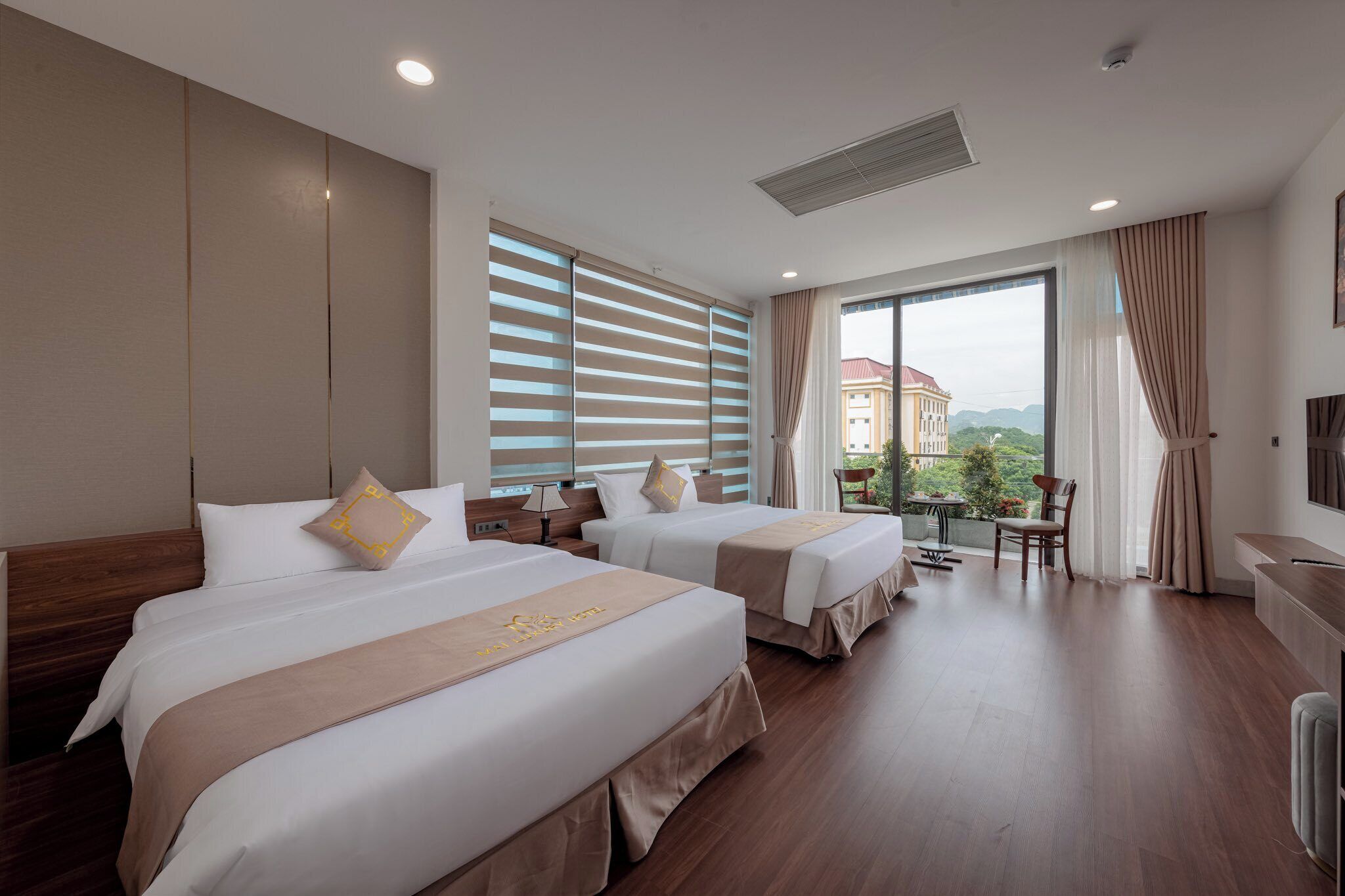 Superior Quadruple Room, City View | Minibar, desk, laptop workspace, blackout curtains