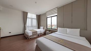 Standard Triple Room, Balcony | Minibar, desk, laptop workspace, blackout drapes