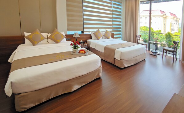 Superior Quadruple Room, City View | Minibar, desk, laptop workspace, blackout drapes