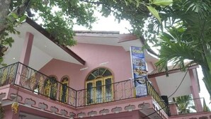 A pink building with a balcony and a sign that reads "SOBIA". - Sobia Villa (Jaffna)