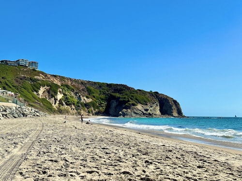 Sunset Haven Cottage-
Beautiful Bright and Clean Condo steps from Strands Beach