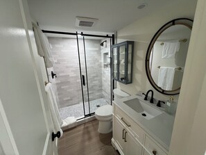 Shower, hair dryer, towels, soap