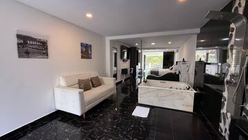 Deluxe Suite, Balcony, Pool View | Desk, free WiFi, bed sheets, wheelchair access