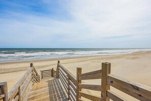 On the beach, sun-loungers