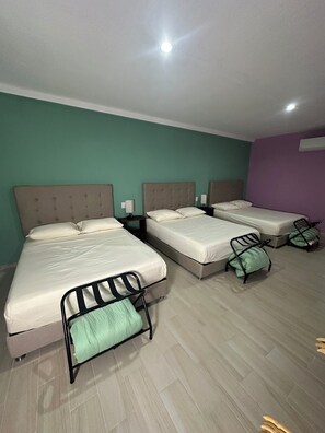Suite familiar | Minibar, wifi gratis y ropa de cama 