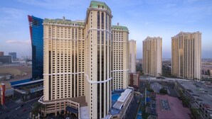 A high-rise hotel with a modern design, featuring multiple floors and a prominent corner structure.