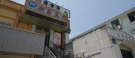A multi-story building with a staircase leading to an upper level.
