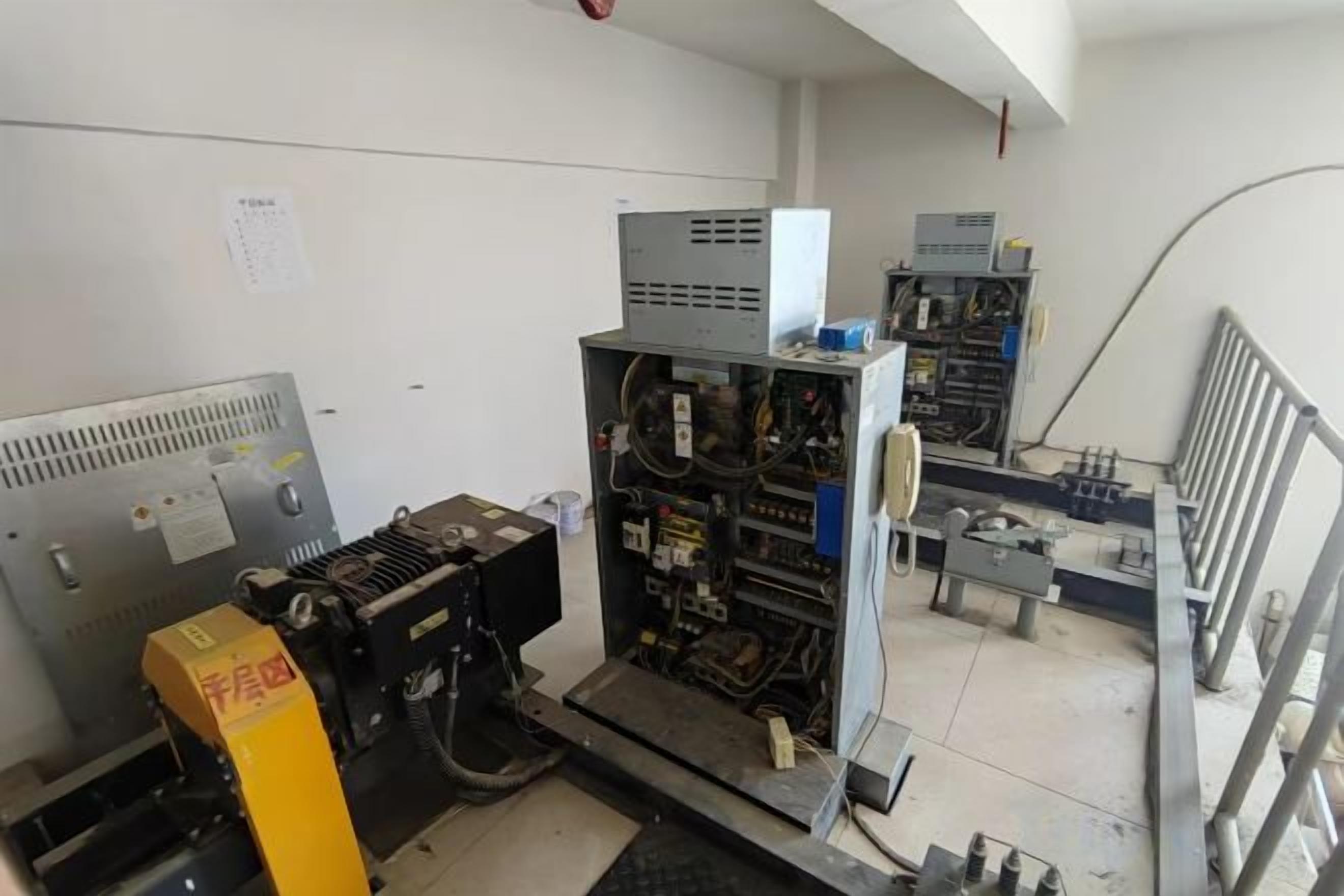 A technical room with various electronic equipment and machinery.