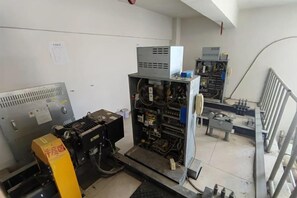 A technical room with various electronic equipment and machinery. - Erenhot Jingtai Hotel (Erenhot)