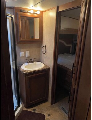 Shower, towels, soap, toilet paper